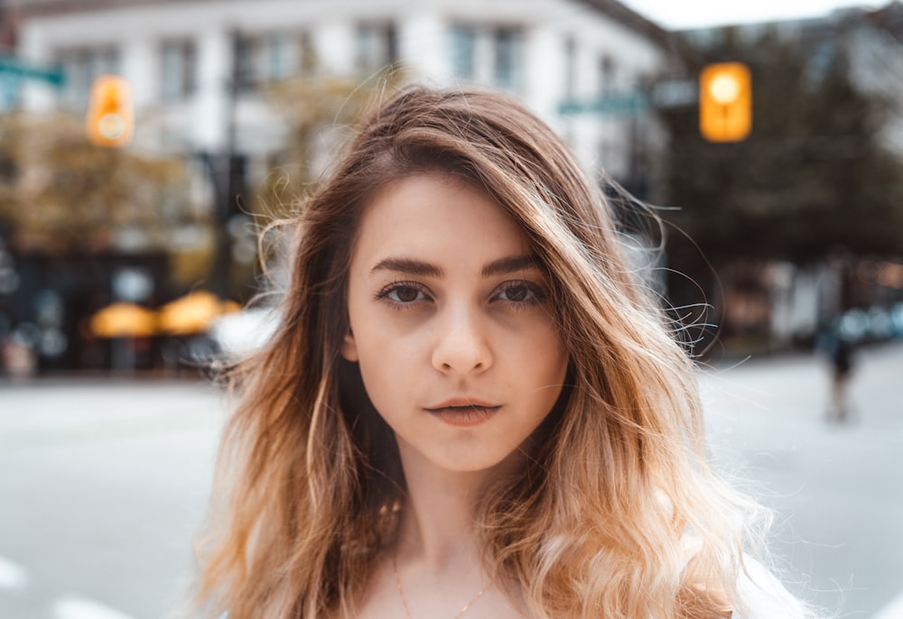 woman in white shirt smiling