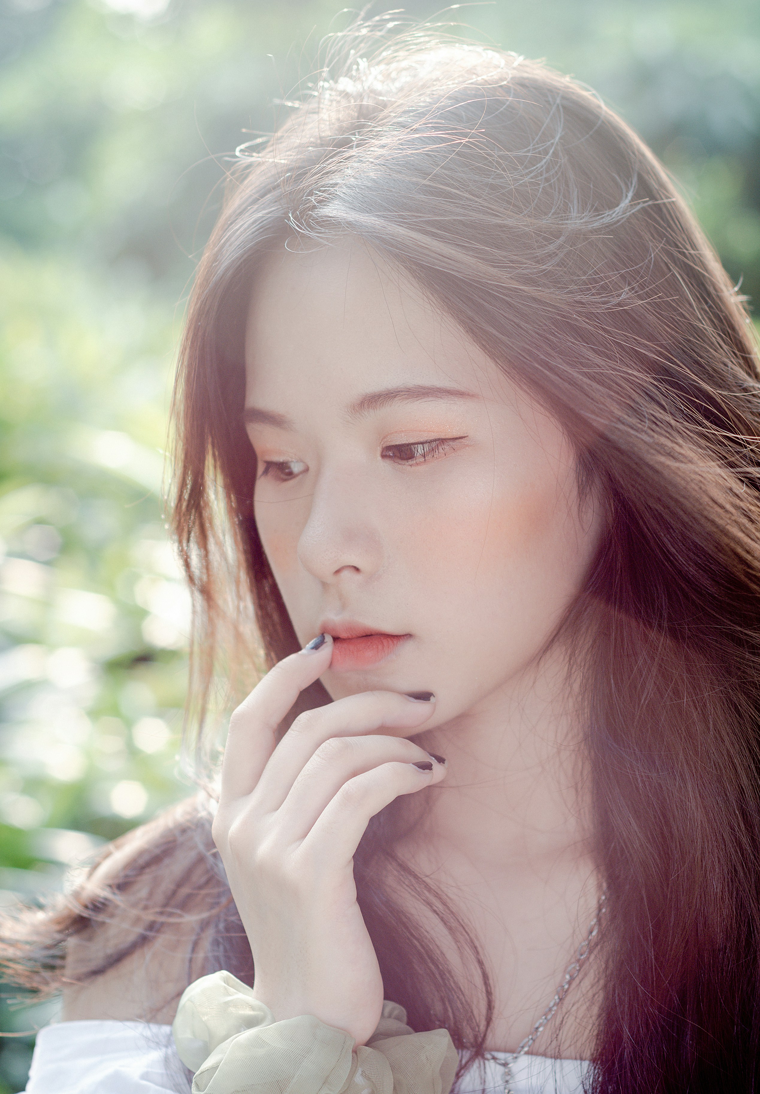 woman in brown and white shirt