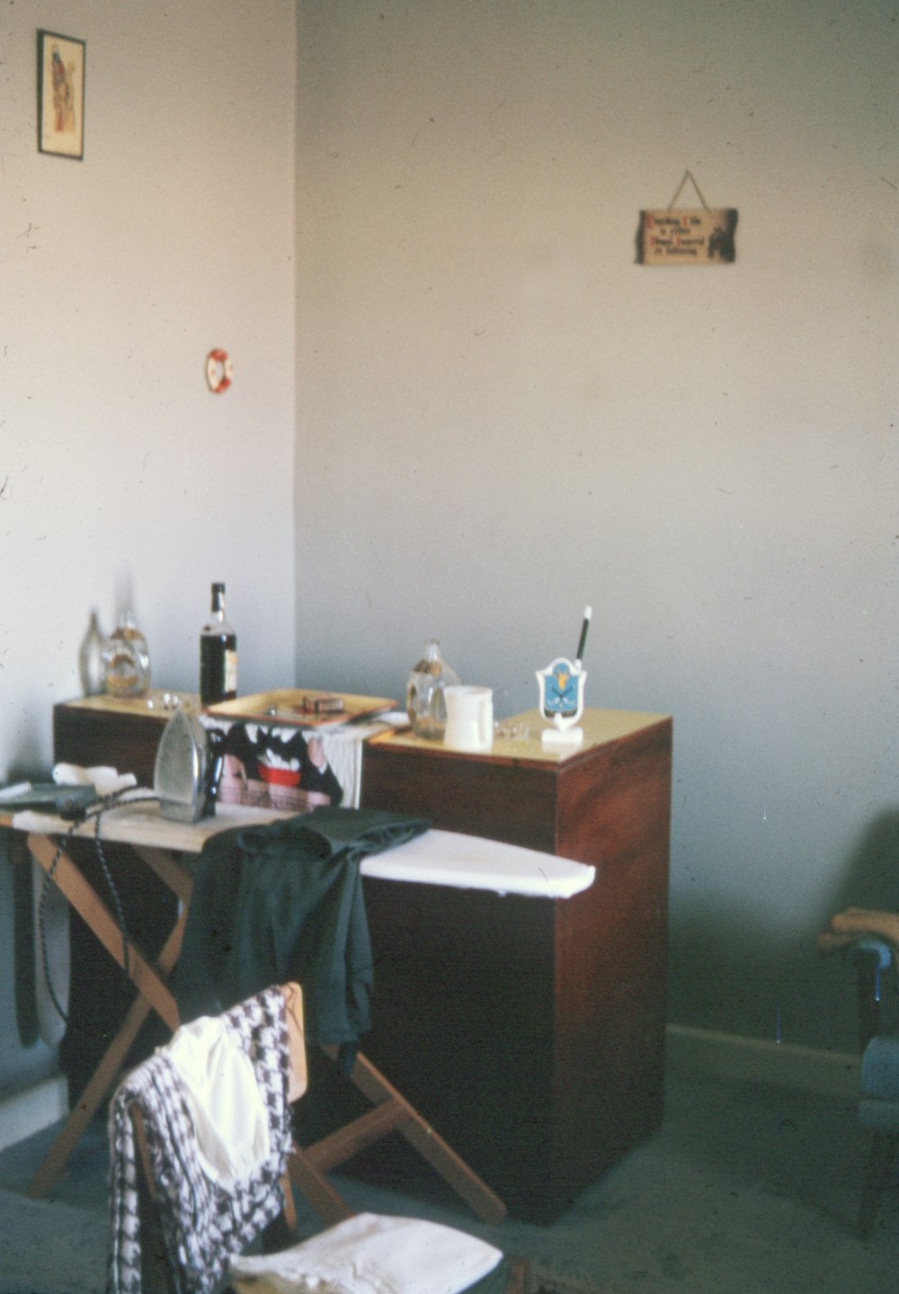 brown wooden desk with assorted items