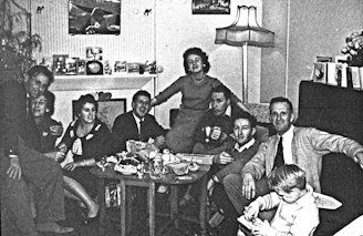 A warm family gathering in a cozy living room, sharing stories and laughter.