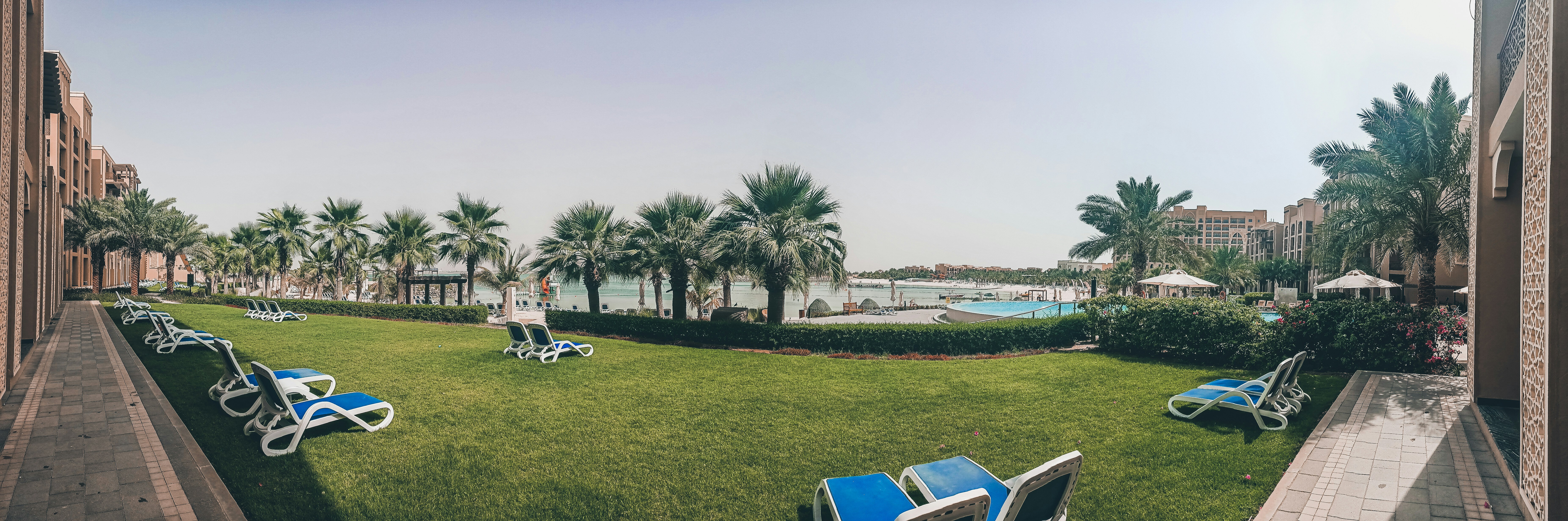 white sedan parked near green grass field during daytime, Staycation, beach, sea, water