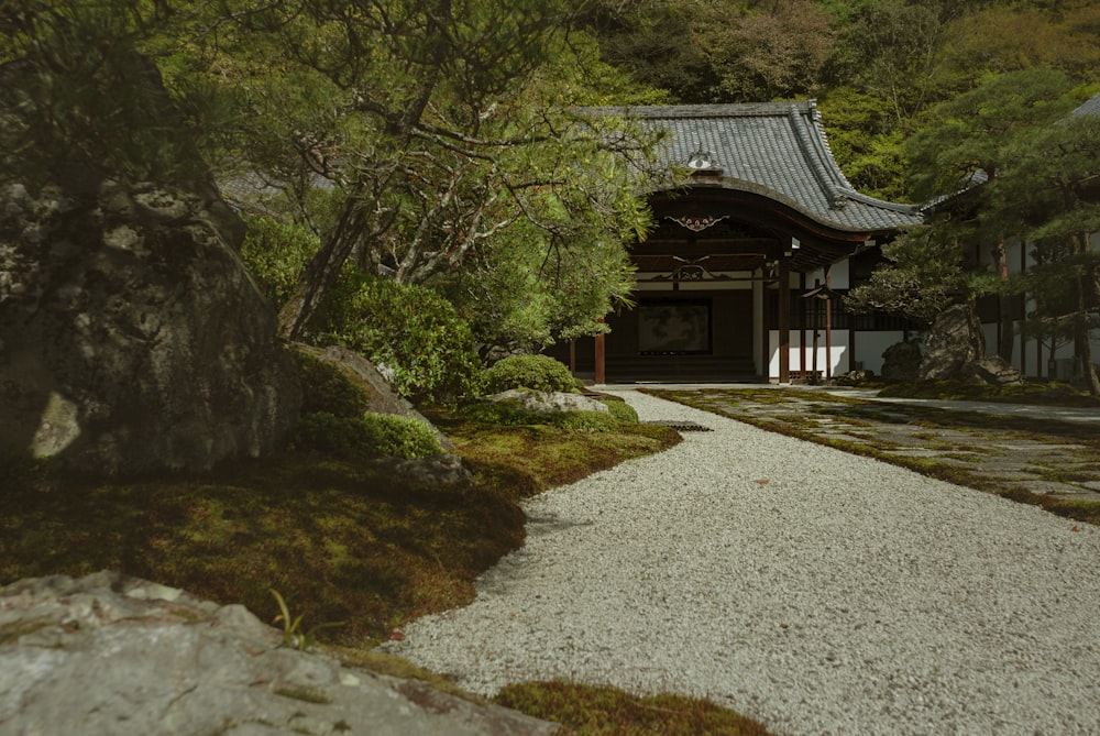 brown wooden gazebo near green trees during daytime