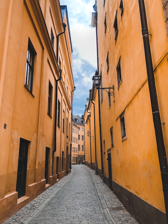 brown concrete building during daytime in Gamla stan Sweden