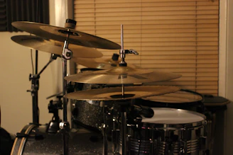A variety of compact drum kits arranged elegantly, perfect for home use.