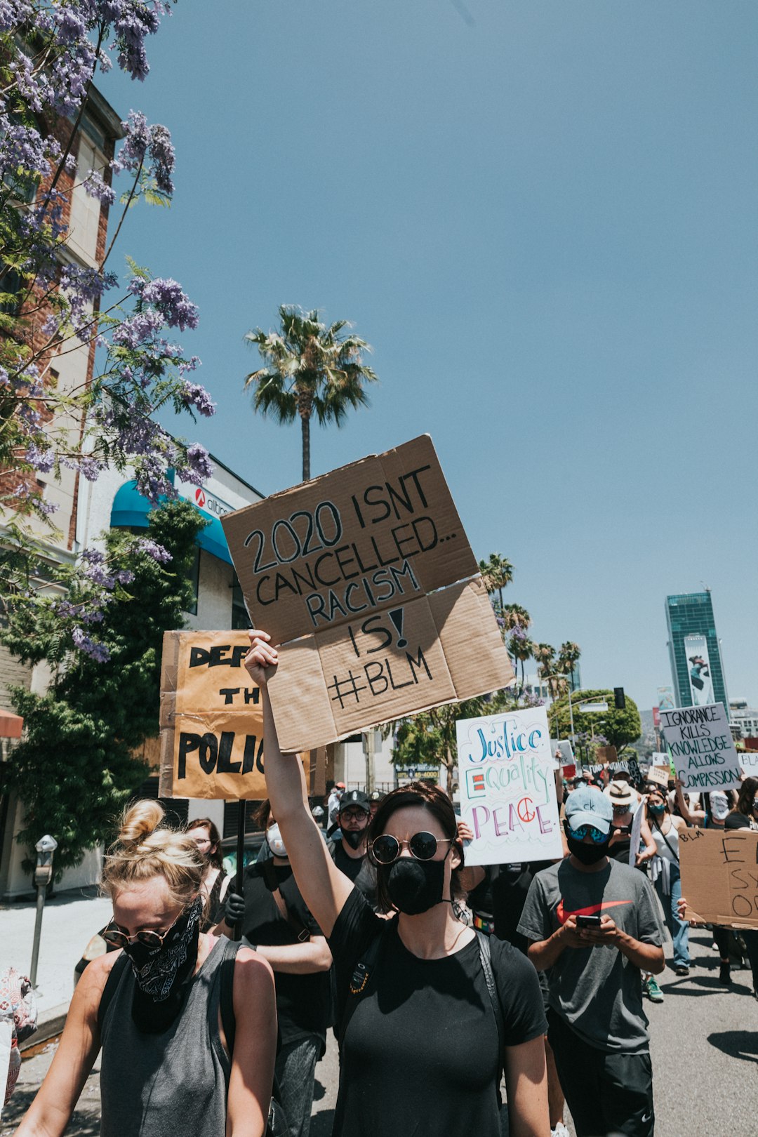 people holding brown cardboard box during daytime