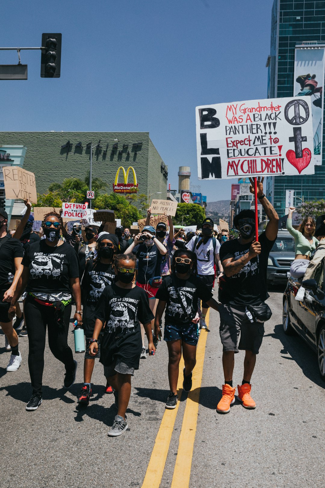 group of people standing on road during daytime