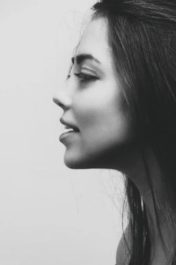 grayscale photo of womans face