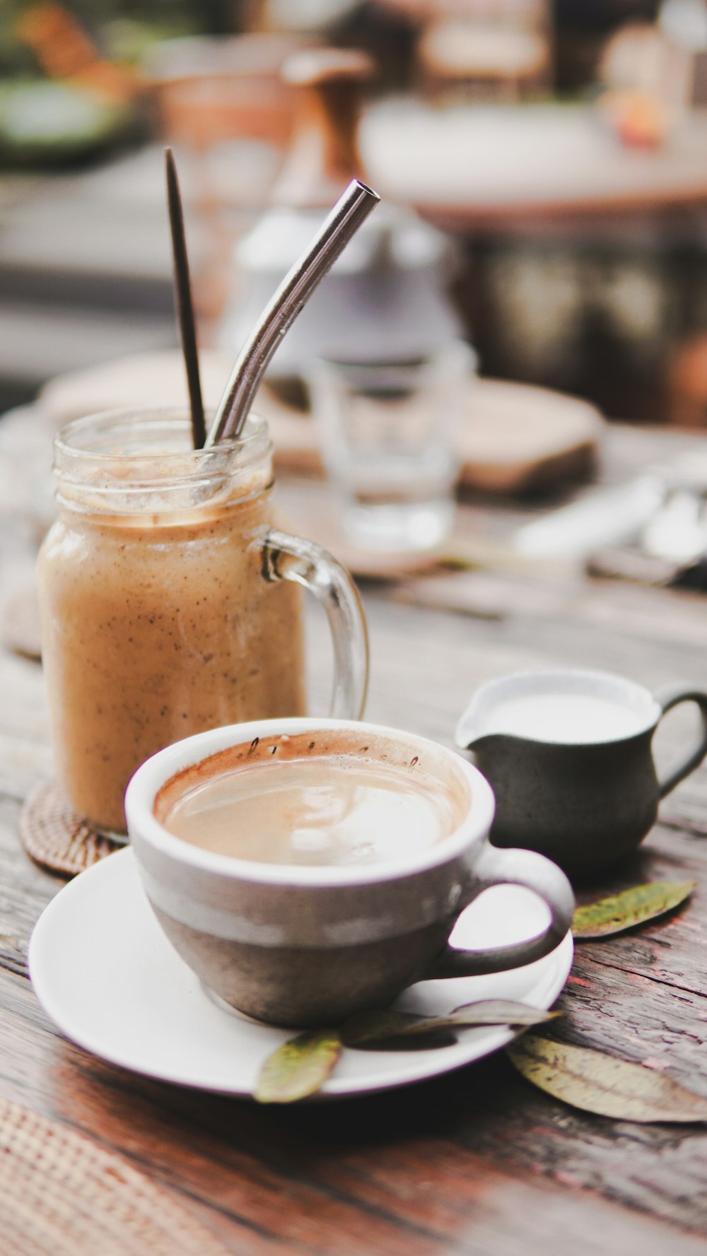 clear glass mug with brown liquid inside