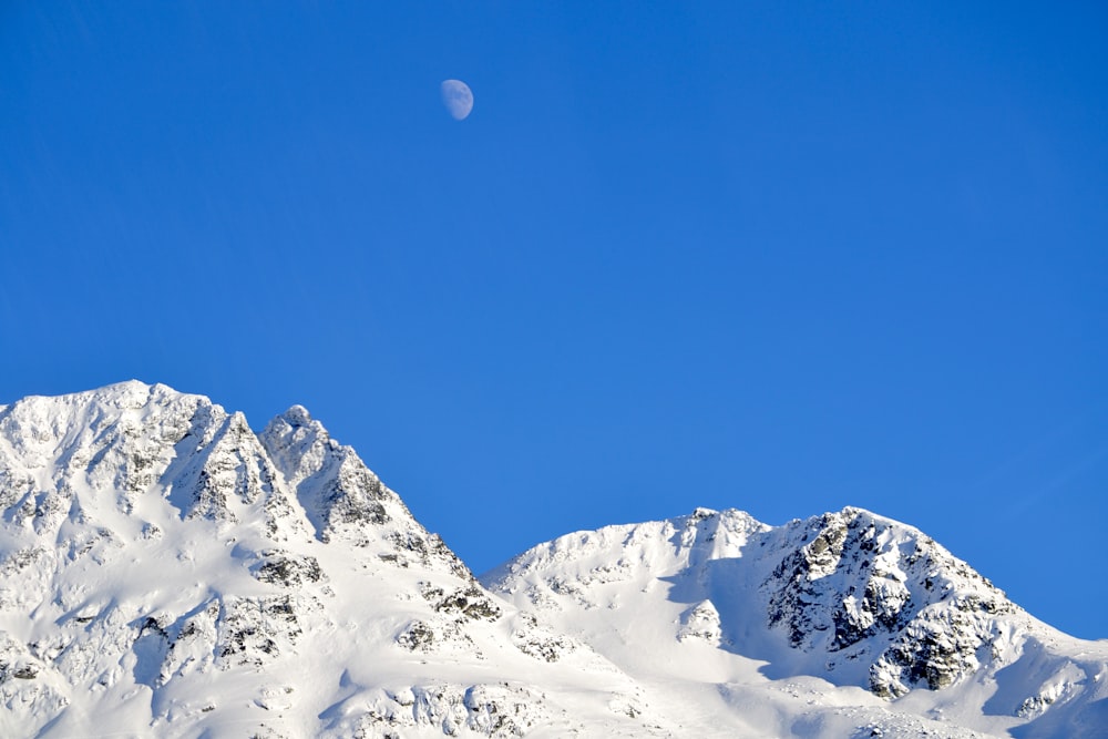 snow covered mountain under blue sky during daytime