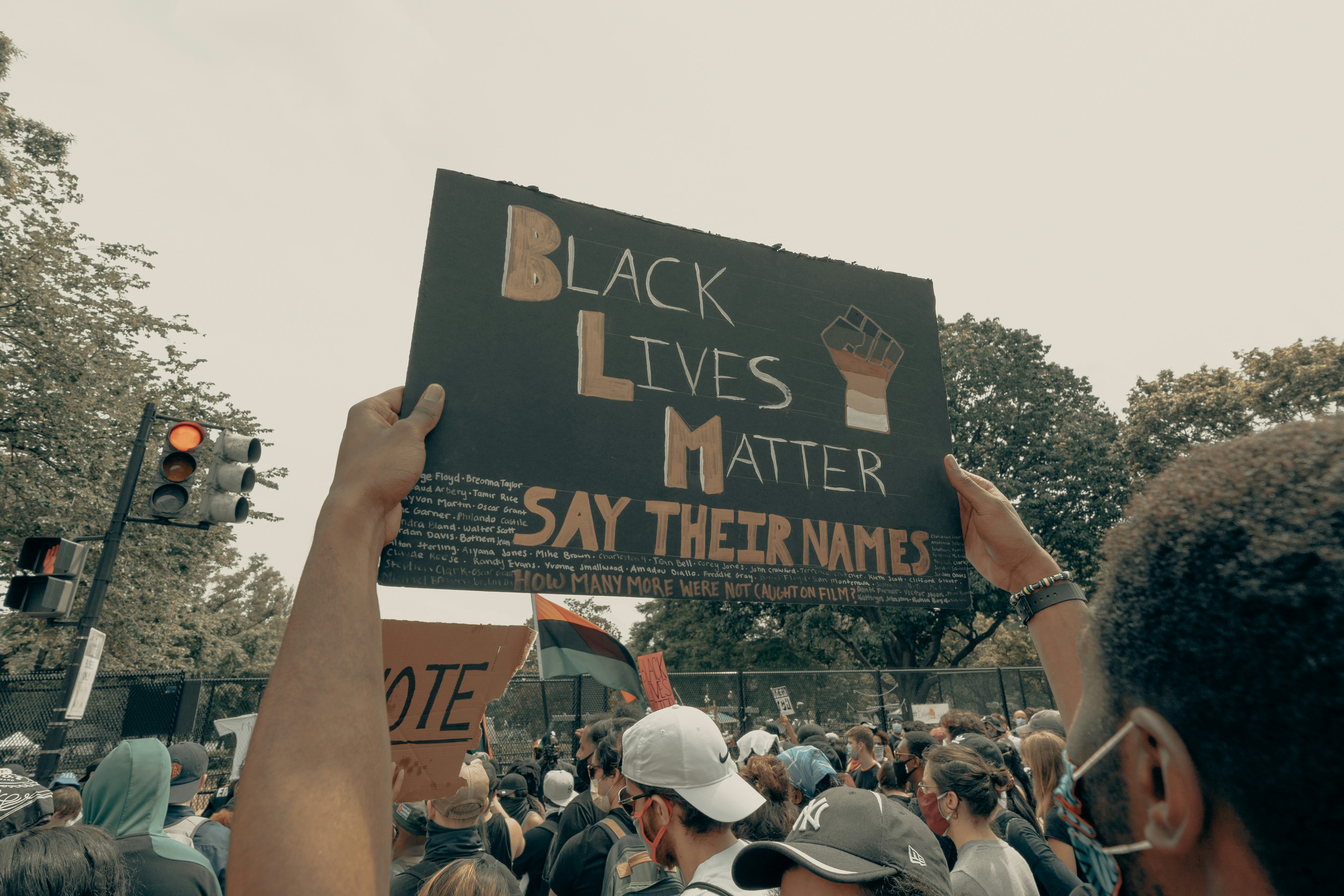 Man holds up a sign at the Black Lives Matter protest in Washington DC 6/6/2020 (IG: @clay.banks)