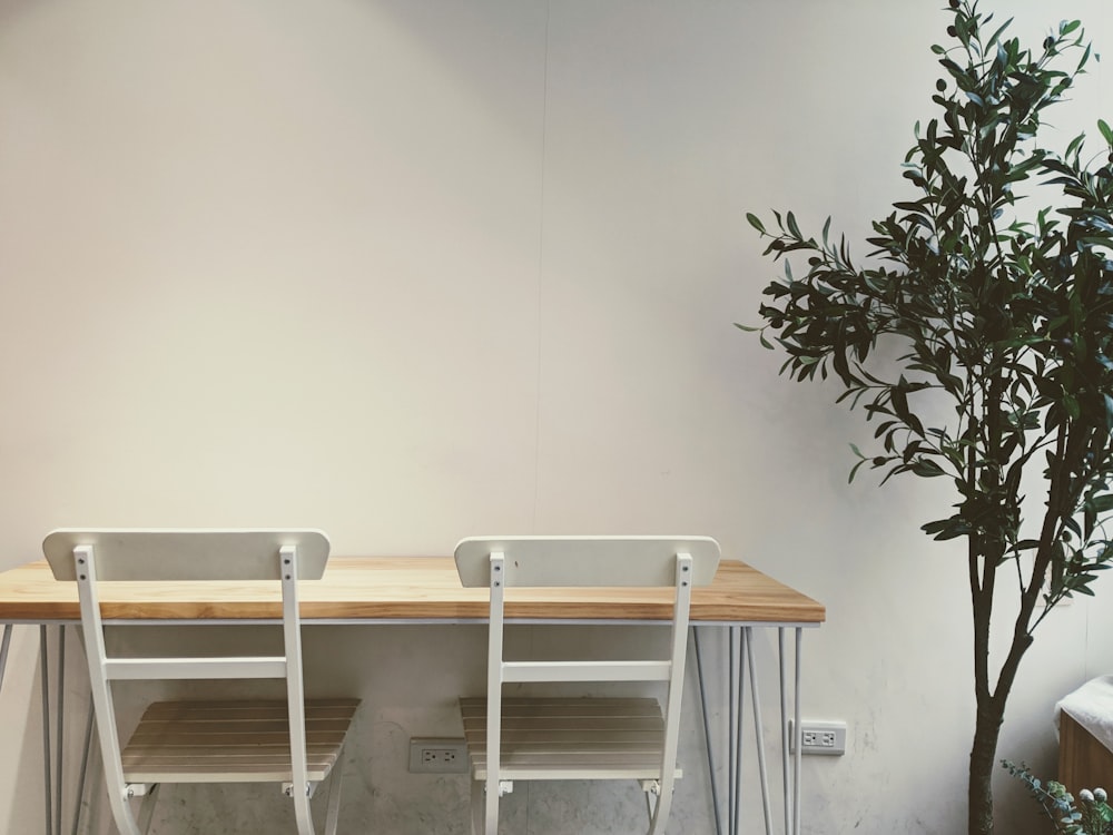 white wooden table with chairs