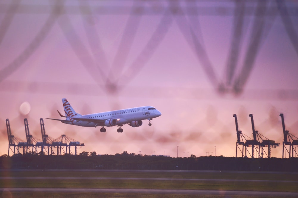 white passenger plane in the sky during daytime