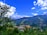 A scenic view of Kudhari village showcasing lush greenery.