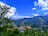 A scenic view of Kudhari village showcasing lush greenery.