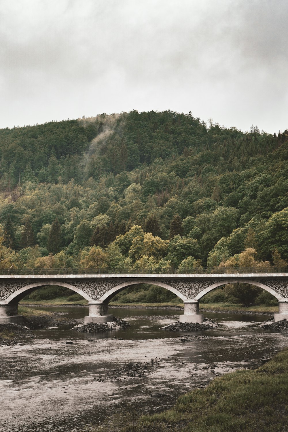 white concrete bridge over river