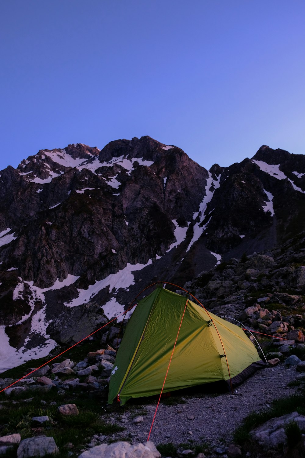 green dome tent near brown and white mountain