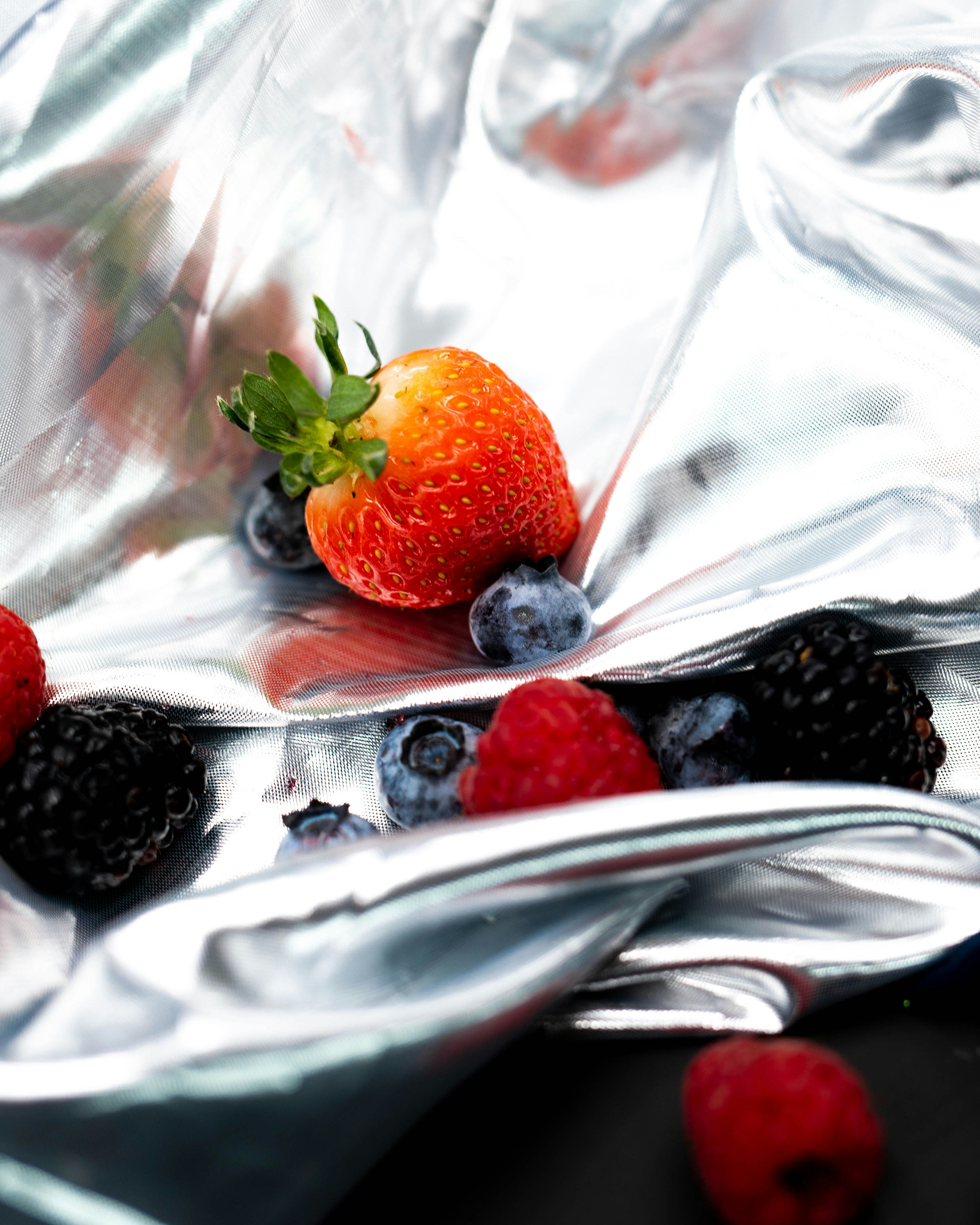strawberries on white textile with white textile