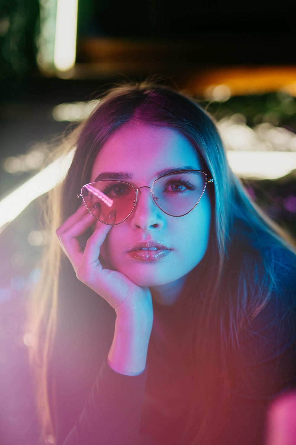 woman in pink long sleeve shirt wearing eyeglasses