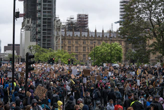 A peaceful gathering advocating for social justice and inclusion in a public park.