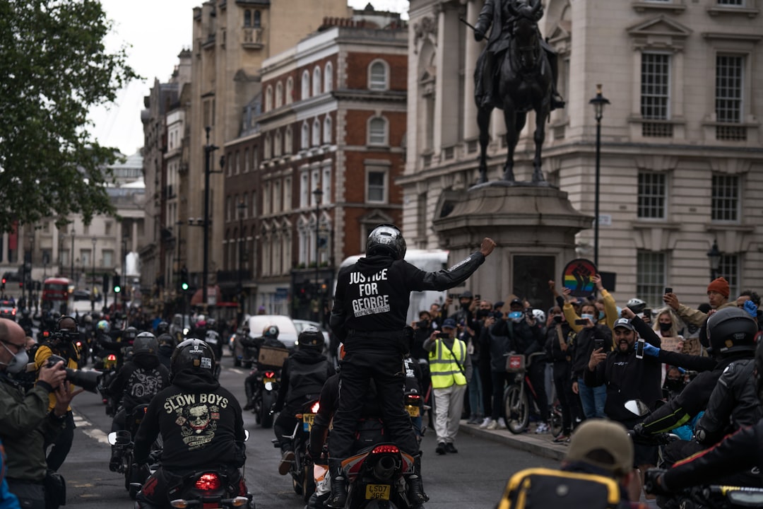 people in black helmet riding motorcycle on road during daytime