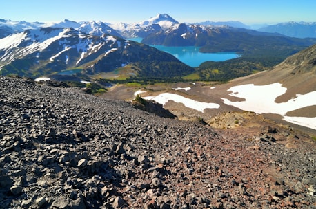 A breathtaking view of Moraine Lake with its turquoise waters surrounded by rugged mountain peaks.