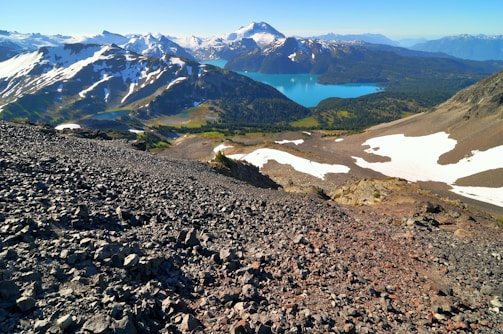 A breathtaking view of the jagged peaks and turquoise lakes of Argentine Patagonia at sunrise.