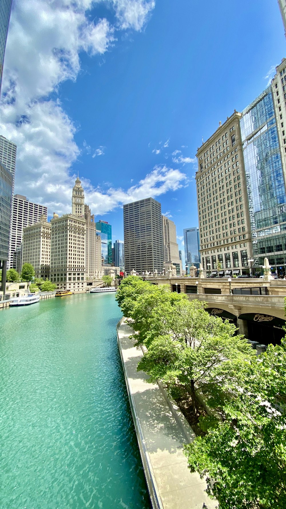 white and brown concrete building near body of water during daytime