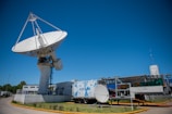 white satellite dish on roof top during daytime