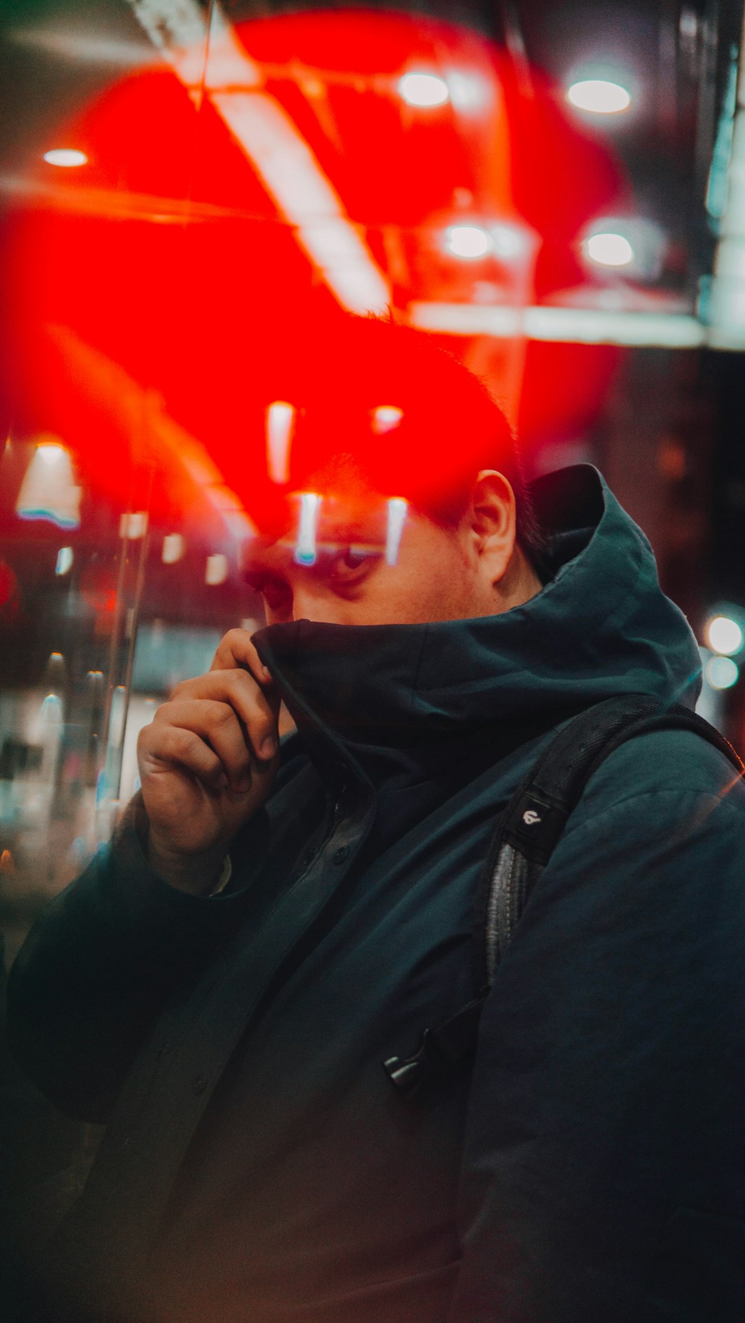 man in black hoodie smoking cigarette