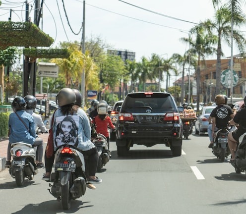 man in black helmet riding on black motorcycle during daytime