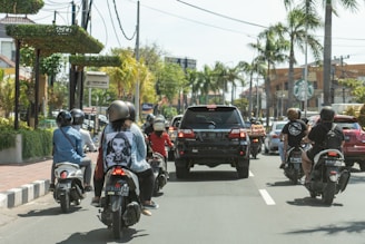 man in black helmet riding on black motorcycle during daytime