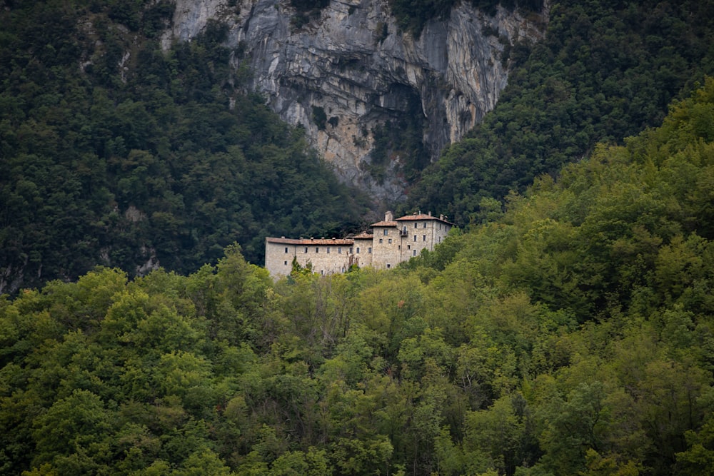 white concrete building on top of mountain