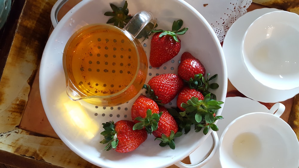 strawberries in white ceramic bowl