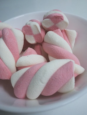 pink and white towel on white ceramic plate