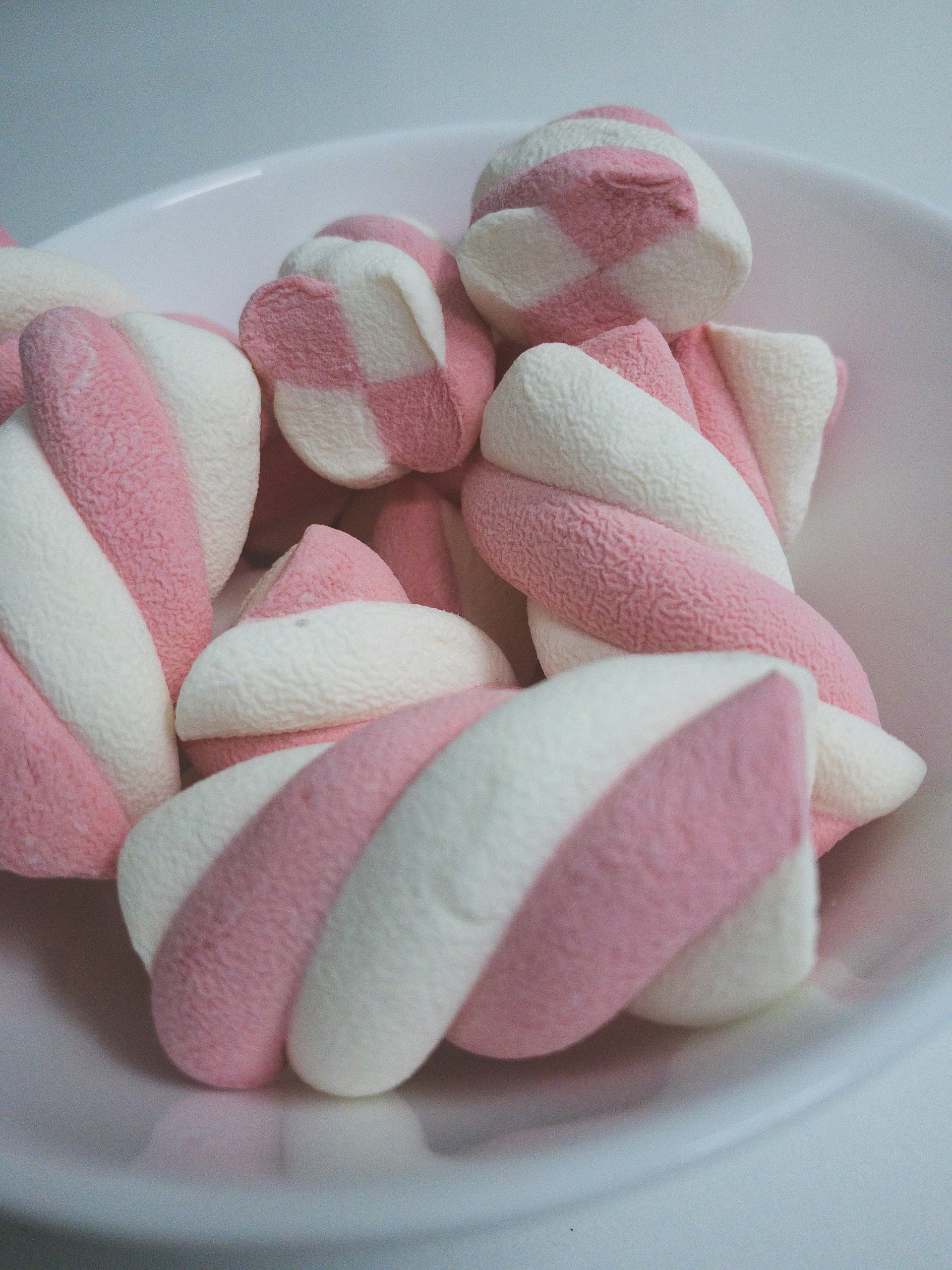 pink and white towel on white ceramic plate