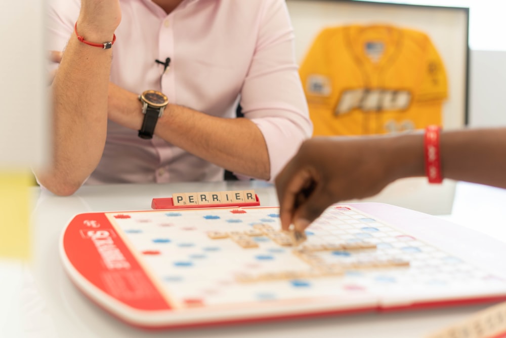 woman in white long sleeve shirt playing chess