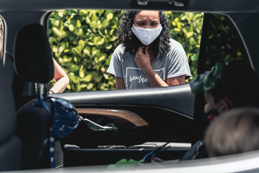 man in black and white crew neck t-shirt wearing white and black face mask