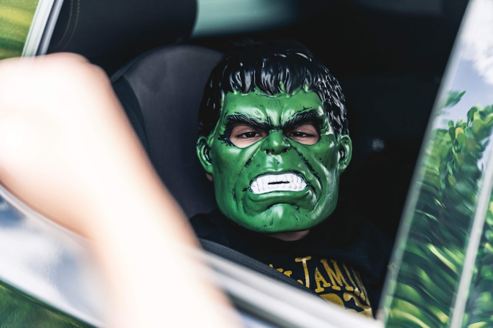 person with green face mask