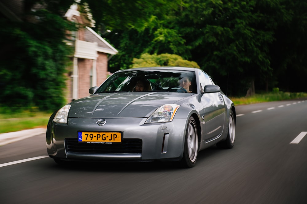 grey porsche 911 on road during daytime