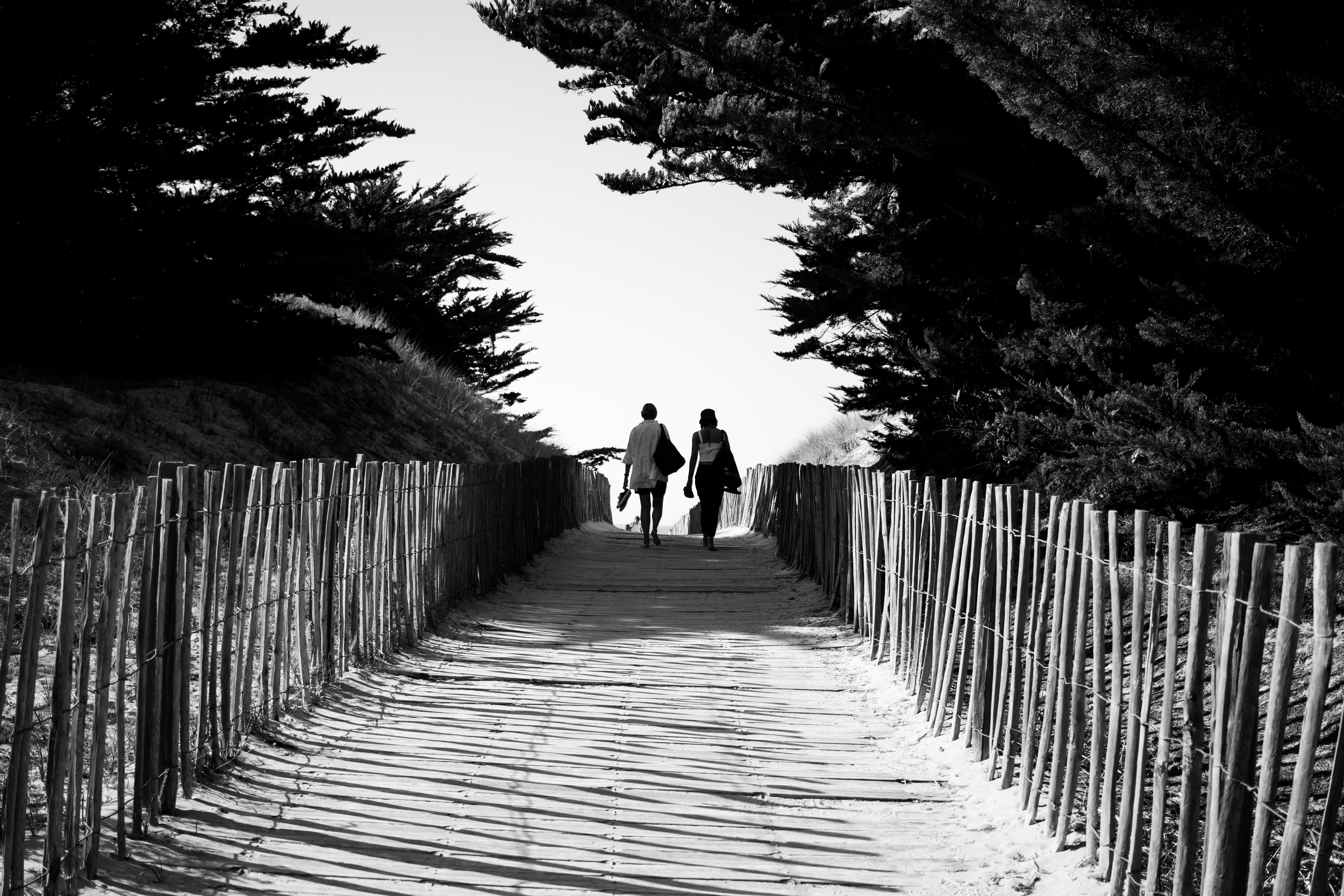 Mother and daughter walking to the beach in Îl de Ré, France