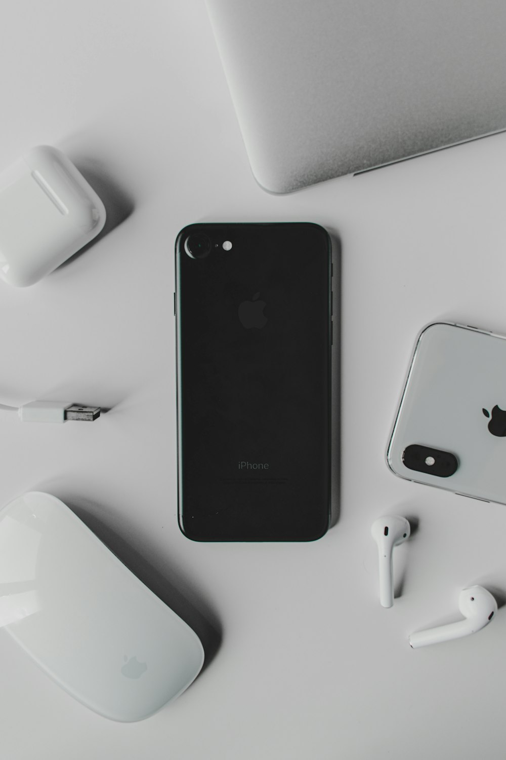 black iphone 7 plus on white charging dock