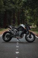 black and silver naked motorcycle on road during daytime