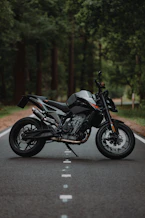 black and silver naked motorcycle on road during daytime