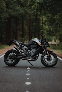 black and silver naked motorcycle on road during daytime