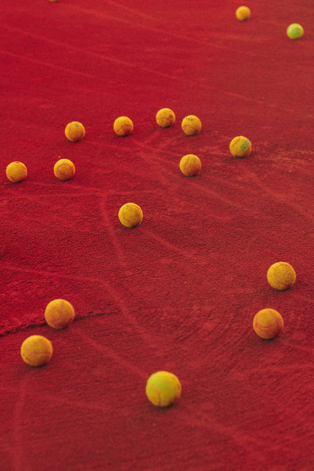 brown round fruits on red textile