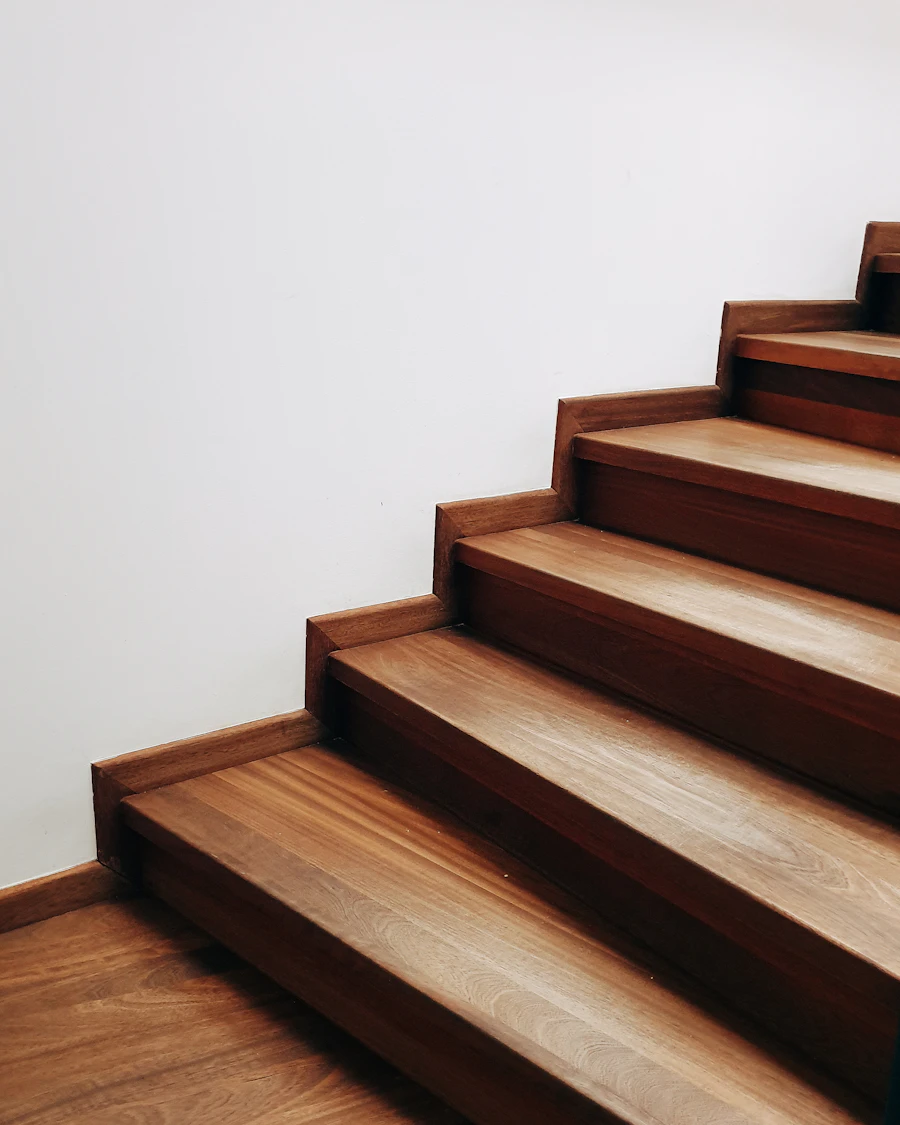 Close-up of wooden stair treads against a white wall