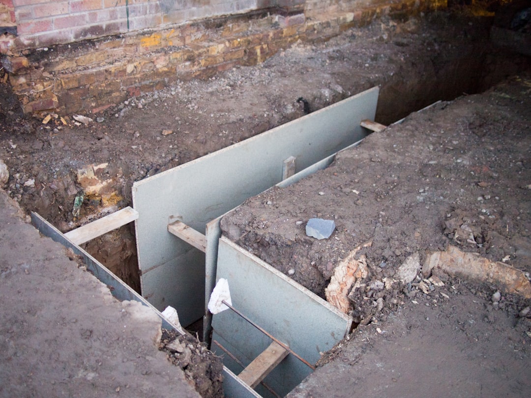 white metal pipe on brown soil