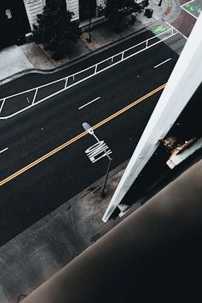 A close-up of a clean, well-maintained urban street with clear markings.