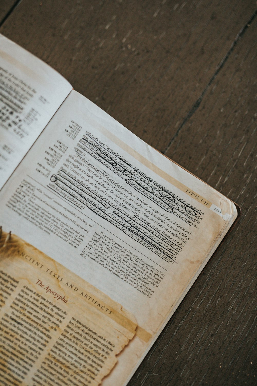 white paper document on brown wooden table