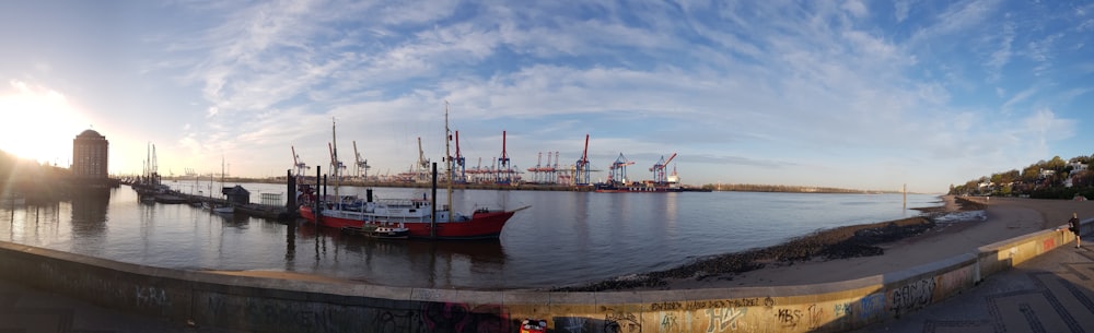 red and white ship on sea during daytime